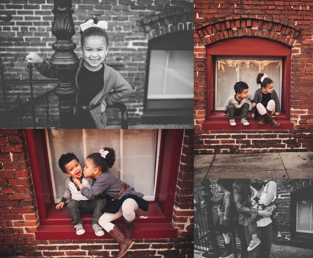 Siblings sitting in red brick window nook in Ybor City, candid kiss between brother and sister, black and white girl portrait by iron railing
